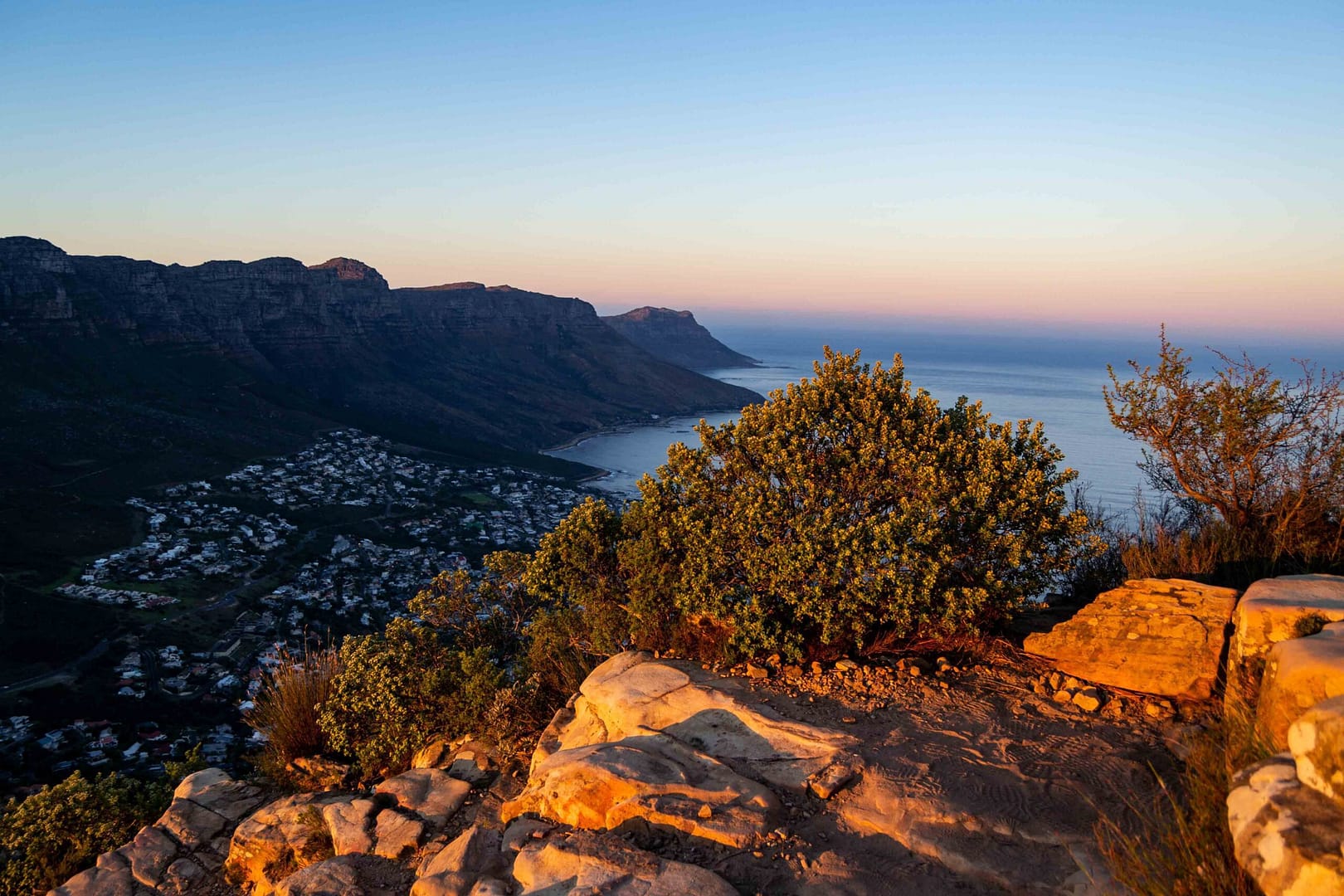 Sunset colours of fynbos and mountains overlooking Camp's Bay on Lion's Head, Cape Town, South Africa. Photographer Stefan Venter.