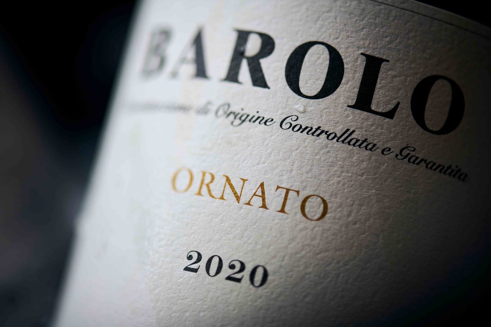 Macro image of Italian Barolo bottle in an ice bucket at a Rueda Wine Consulting exclusive event hosted at Noop Restaurant in Paarl, Cape Town. Stefan Venter Photography.