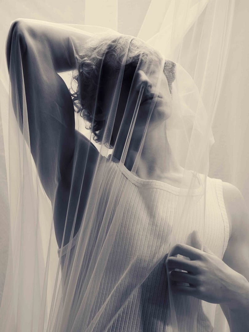 Moody Conceptual art portrait of ginger male model by Stefan Venter Photography. Personal project in collaboration with Neil Doveton in Cape Town. Draped cloth. Black and white