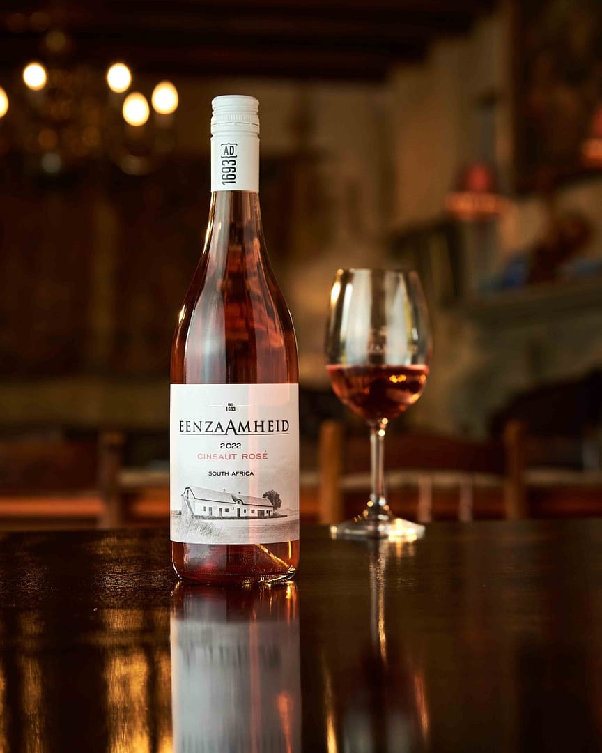 Wine bottle photography on table on location by Stefan Venter photographer. Cape Town, South Africa.